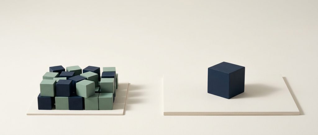 Shared hosting versus a dedicated server A crowded cluster of blocks on one platform beside a single navy cube alone on another, contrasting shared hosting with dedicated.