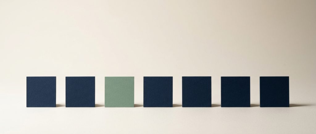 Content and social publishing on a schedule Seven small squares in an evenly spaced row with one sage, representing a steady publishing rhythm.