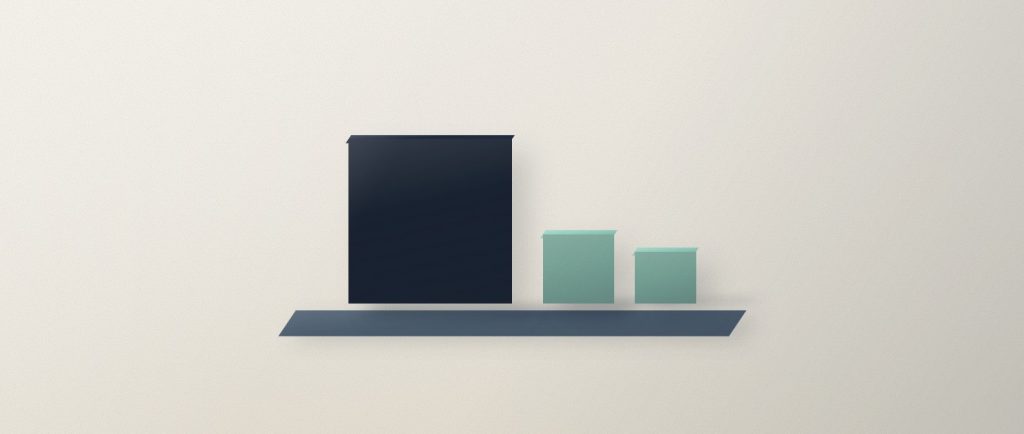 One navy block standing on a base with two smaller sage blocks tucked close beside it.